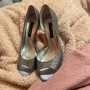 Brand new never worn silver 2 1/2 inch heels